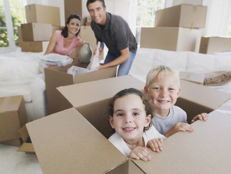 House removal team planning a move in Canary Wharf with high-rise apartments in the background