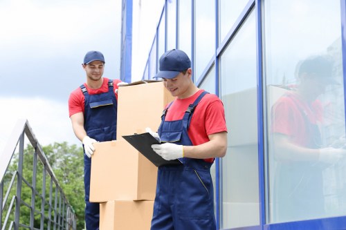 Removal team planning a move near Canary Wharf apartment buildings