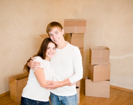 Moving boxes and furniture loaded into a van for a local relocation