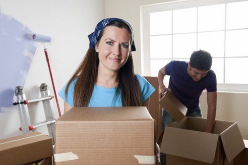 Local movers preparing boxes in a Canary Wharf high-rise building