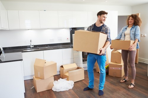 Furniture and boxes being loaded for a home move near Canary Wharf