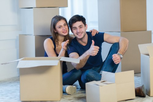 Careful unpacking of household boxes in a modern Canary Wharf home