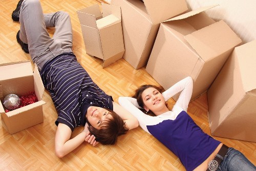 Local movers handling furniture during a Canary Wharf home relocation